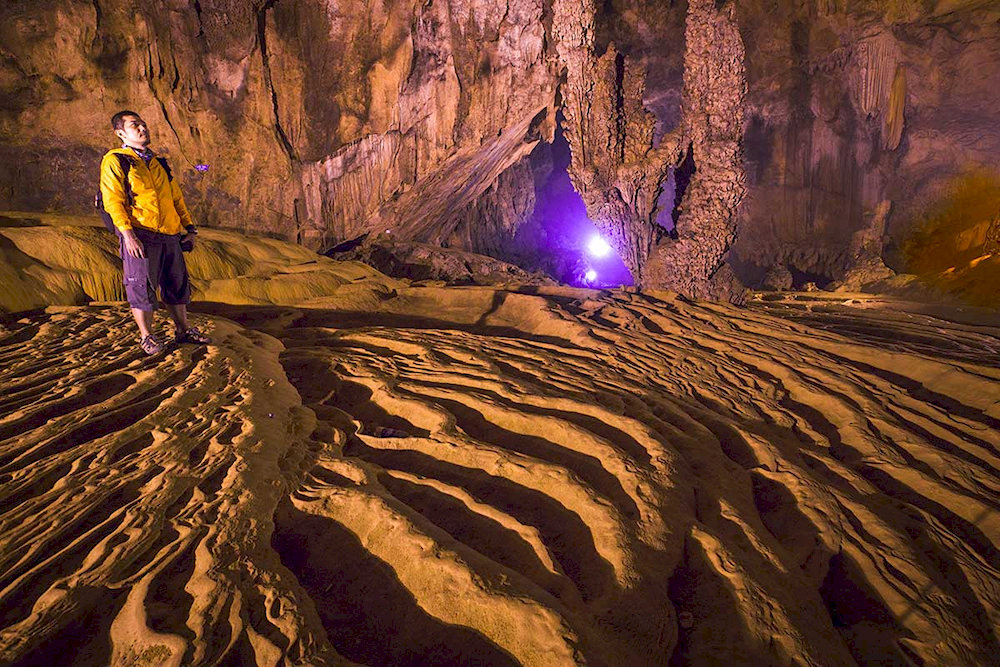 This cave’s mesmerizing rock formations make Nguom Ngao a must-see destination for geology lovers and adventure seekers alike